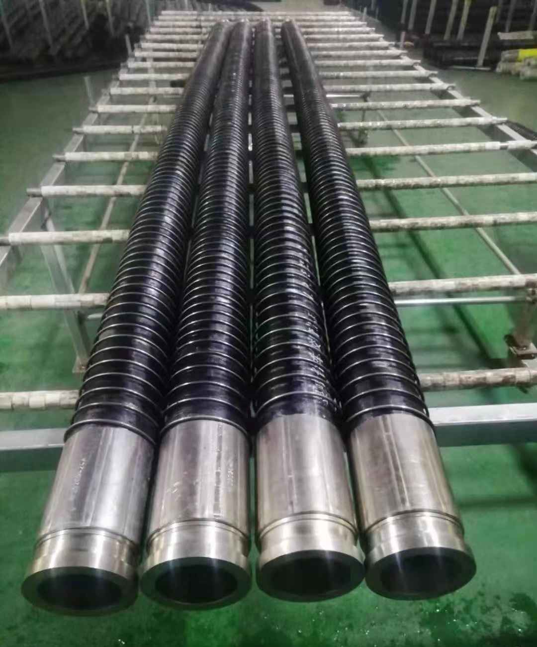 Concrete pump hose used in high-temperature construction site, showing risk of softening and aging